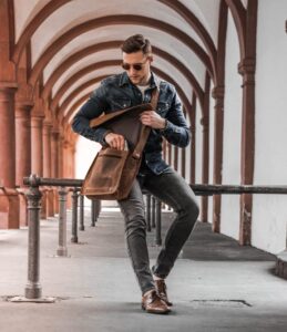 A man wit a messenger bag