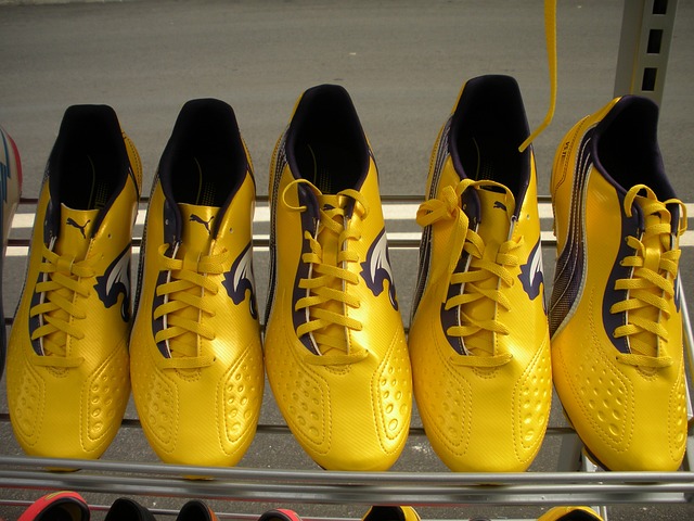 A row of first-rate soccer shoes on a shelf.