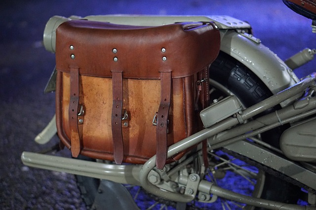 A leading motorcycle with a leather saddle bag.