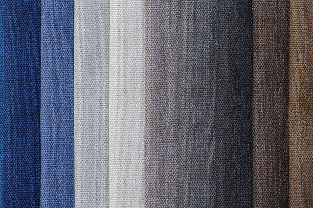 A chic lineup of ten textured fabric swatches shows a seamless gradient from deep navy to rich browns, showcasing versatile options for stylish fashion accessories.