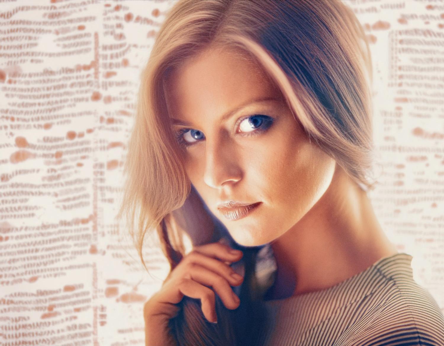 A woman with long, flowing hair and bright blue eyes gazes confidently, wearing a chic striped top. Her hand toys with her hair, set against a pastel abstract backdrop echoing Samsonite luggage designs.