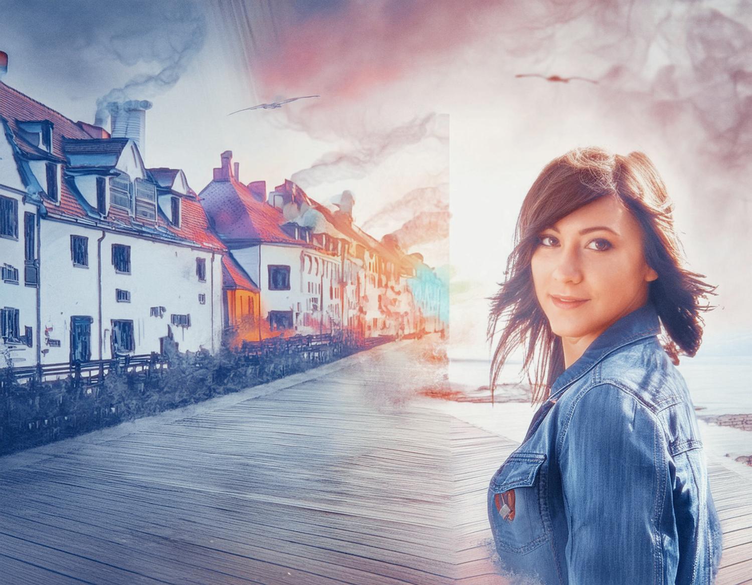 A woman with dark hair and a chic denim jacket stands on a boardwalk, surrounded by vibrant vintage buildings, under a dreamy sky with birds.