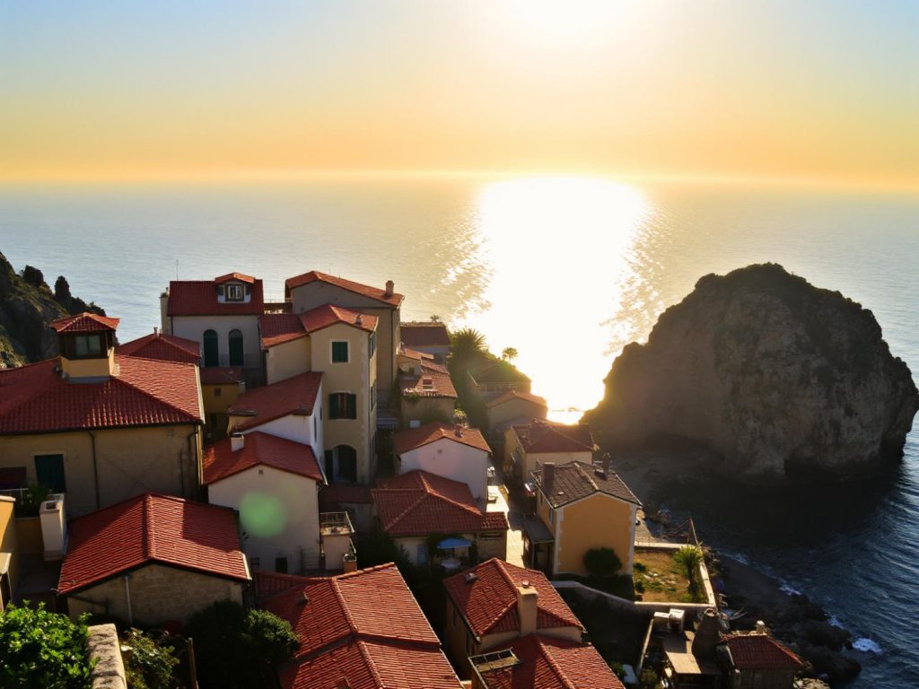 Stunning sunset over a coastal village sets a serene stage where fashion meets nature—think nautical stripes and sun-kissed accessories.
